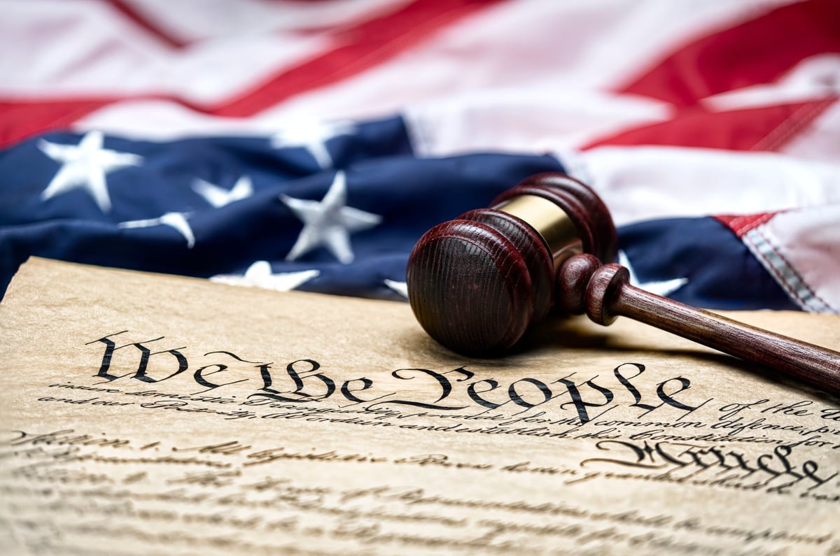 American flag and United States Constitution representing the we the people legal heritage